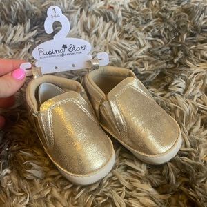 NEW Gold Slip on. Never been worn. Size 1 3-6 months